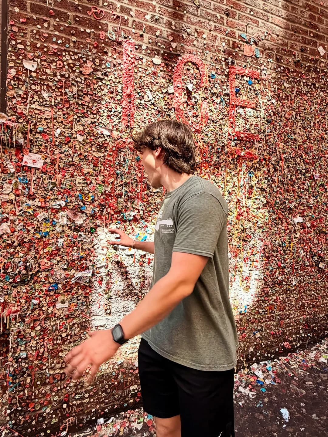 Grant beside Seattle’s colorful Gum Wall.